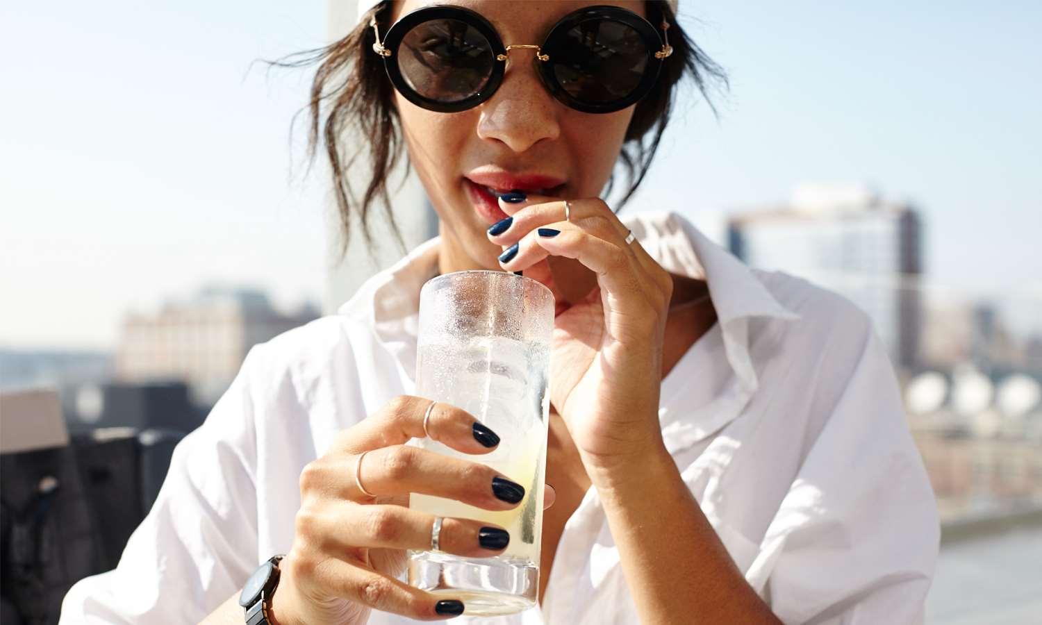 Royalton Park Avenue Hotel New York Exterior photo A woman drinking a glass of water